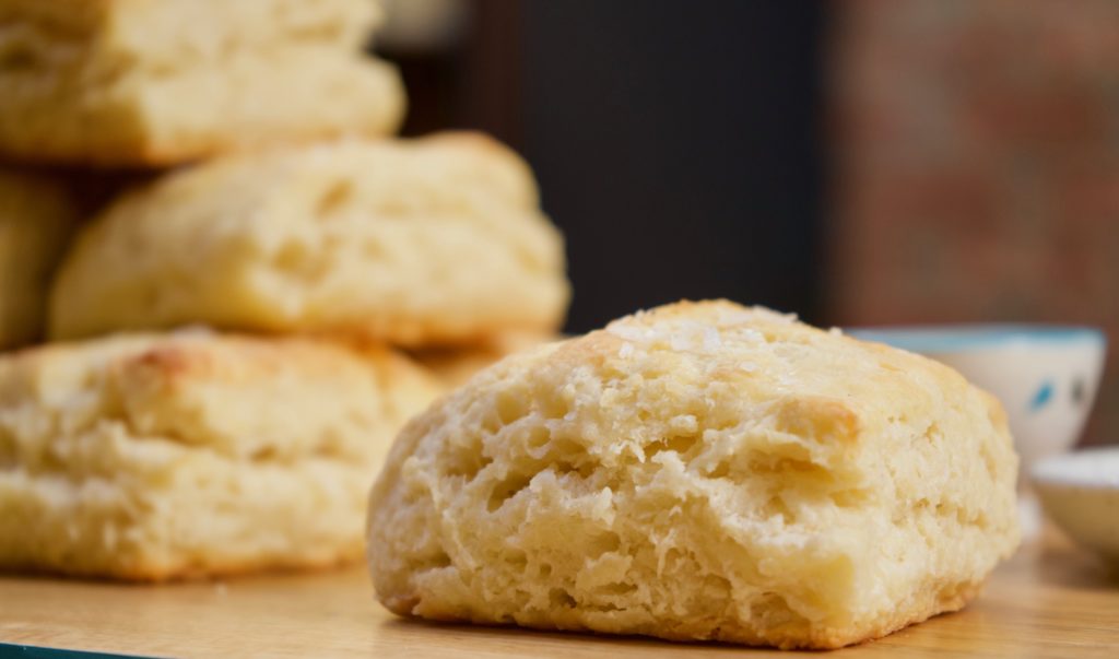A light, flaky buttermilk biscuit topped with sea salt. The best with butter and jam hot out of the oven!