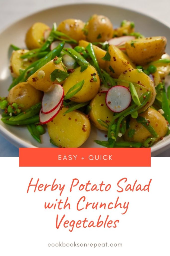 Herby Potato Salad tossed with mustardy vinaigrette, crunchy snap peas, radishes, herbs and scallions.