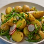 Herby potato salad with crunchy vegetables.