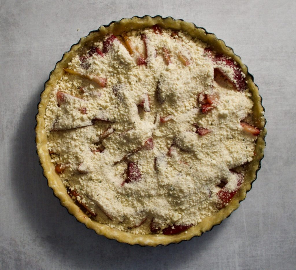 Rosemary scented streusel spooned over slices of tart and sweet plums. 