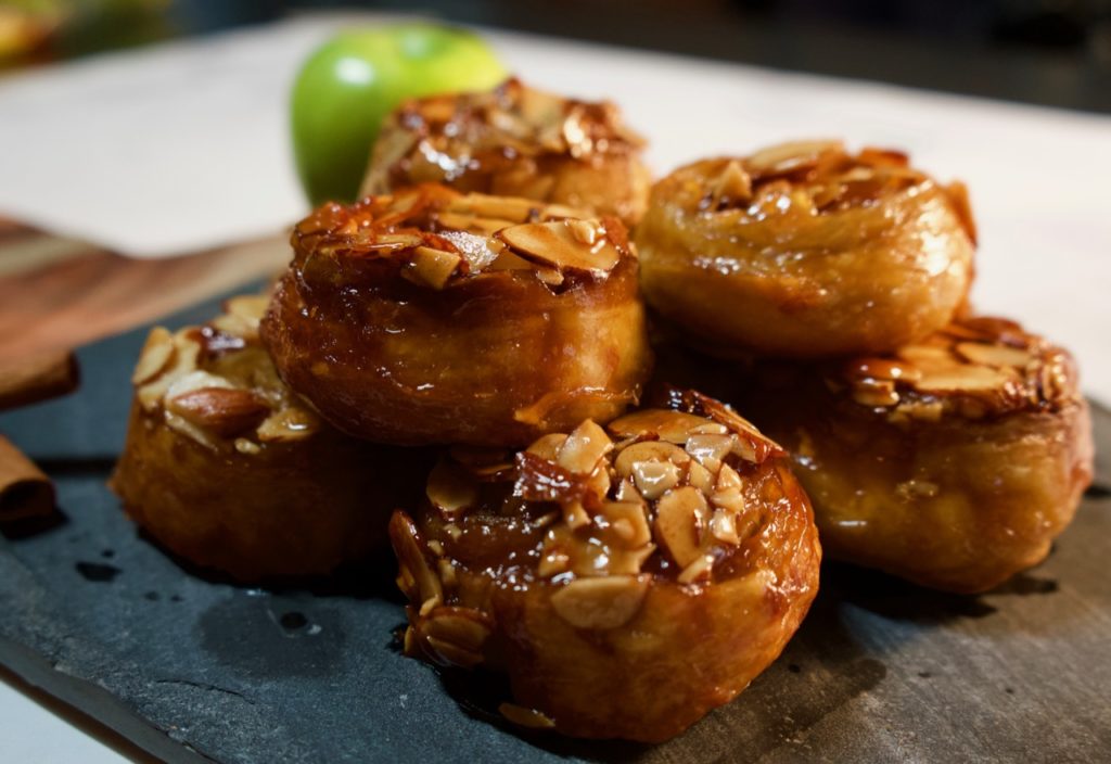 Easy sticky buns filled with apples and cinnamon. Buttery caramel and toasted almonds top these buns to make a special breakfast treat.