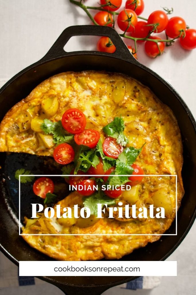 An easy potato frittata spiced with whole cumin, coriander and mustard seeds. Tender potatoes and sweet onions make this a delicious egg dish for any time of day or night! For a little freshness, a tomato and herb salad dressed with lime tops it all off.