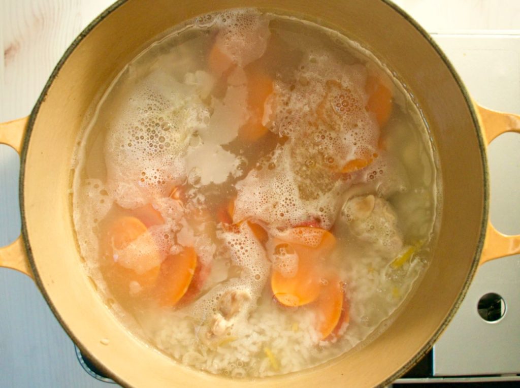 Pot with simmering ingredients.