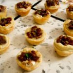 brie tartlets on marble board