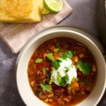 bowl of chili with conrbread