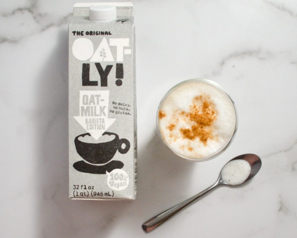 oatly oat milk and latte with spoon