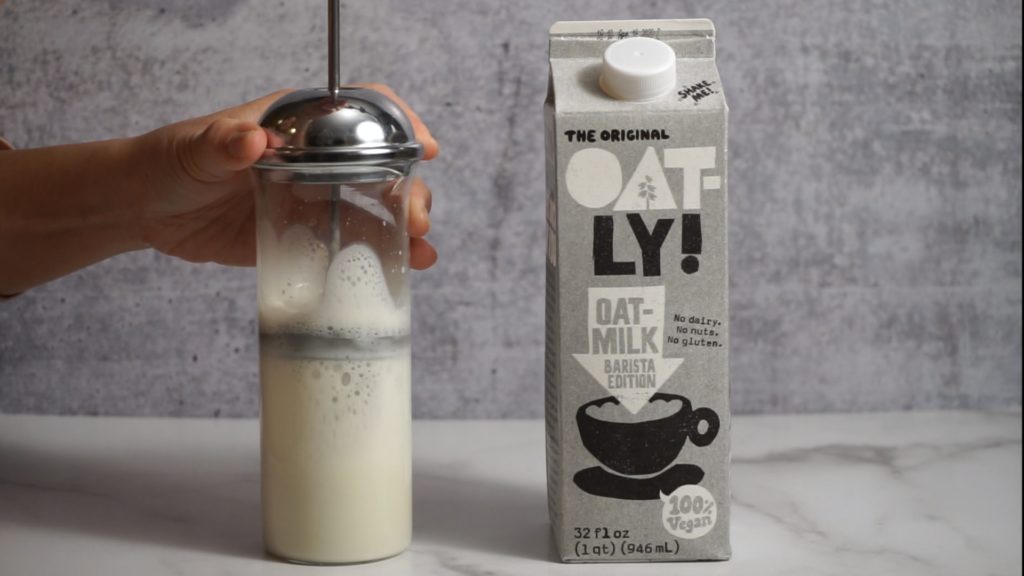 oatly oatmilk carton and milk frother