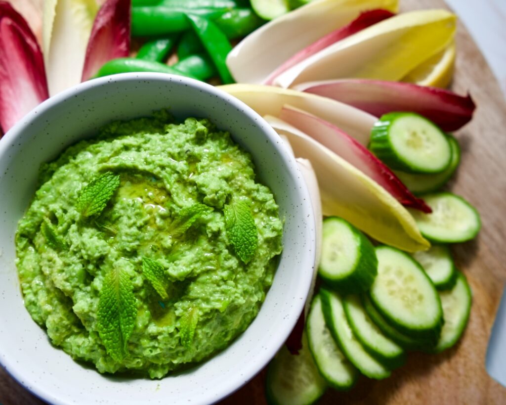 Dip with platter of vegetables.