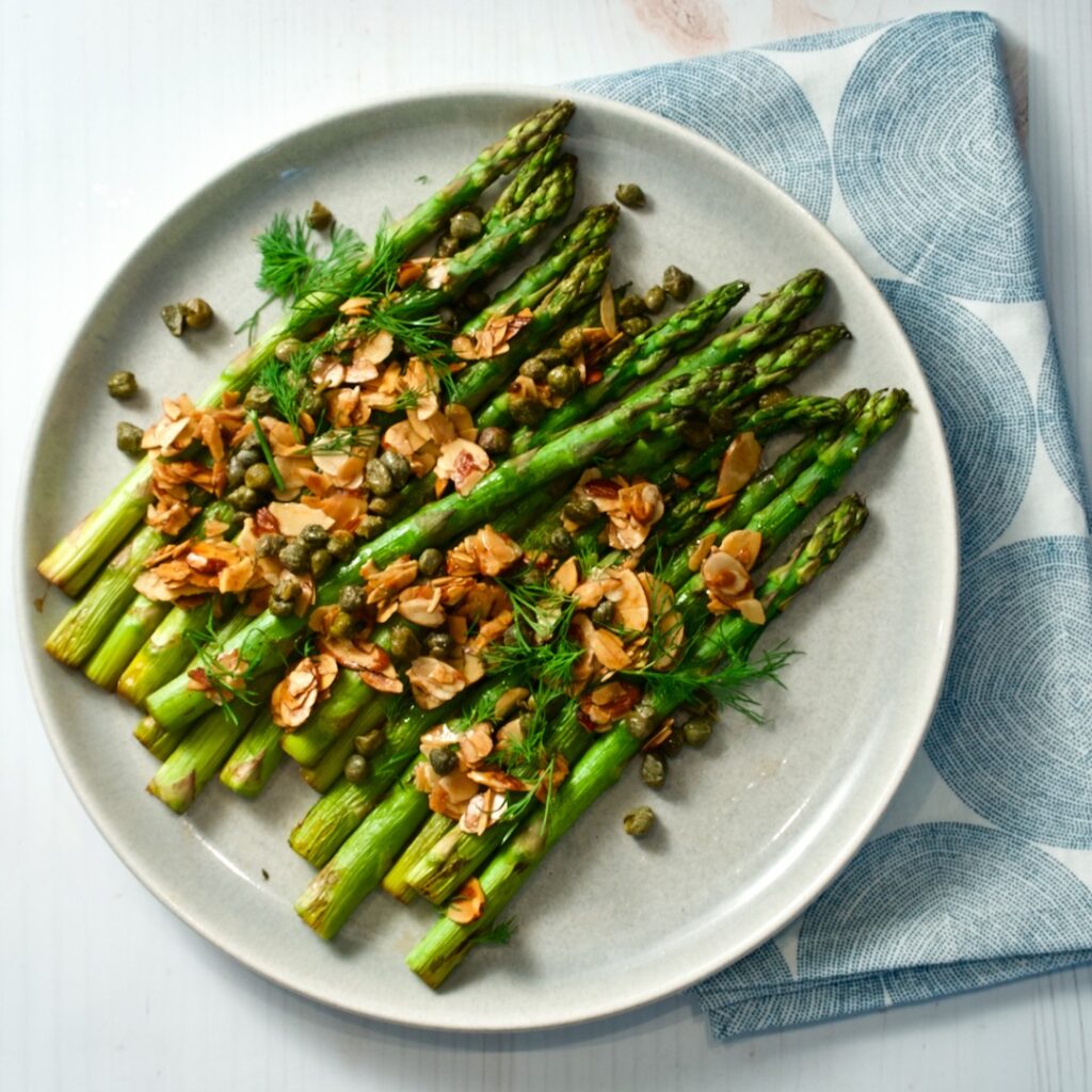 Asparagus on a plate with napkin.