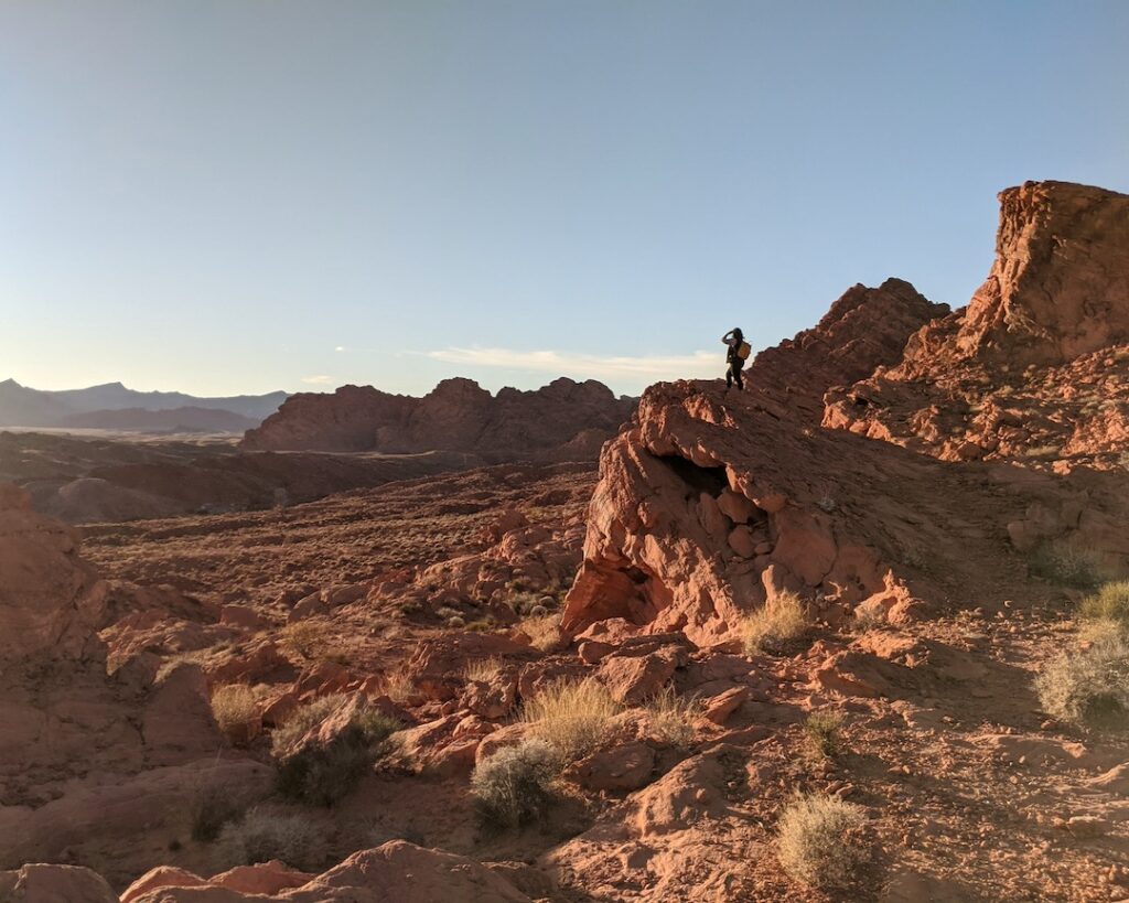 Woman on rock in the desert.
