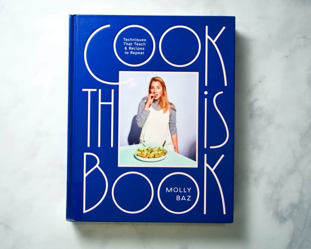 Front cover of cookbook "Cook This Book" by Molly Baz.